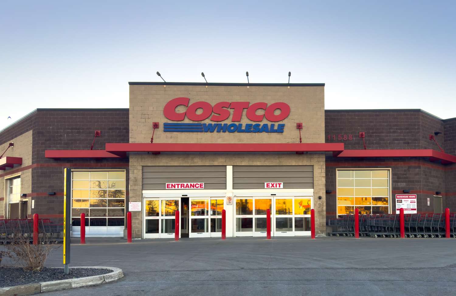 A Costco Wholesale storefront with entrance and exit signs visible