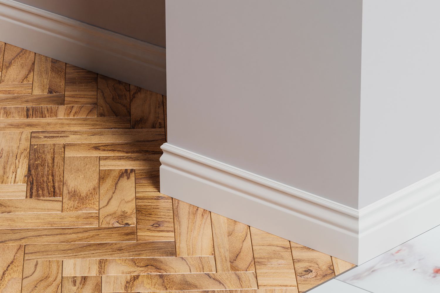 baseboard trim against modern wood floors and marble floor