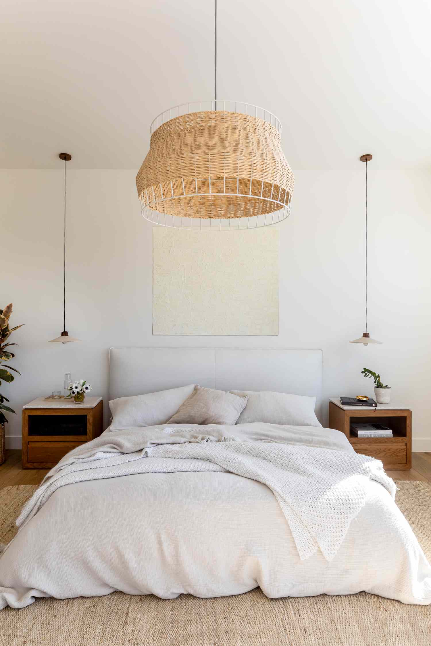 white bedroom with woven pendant