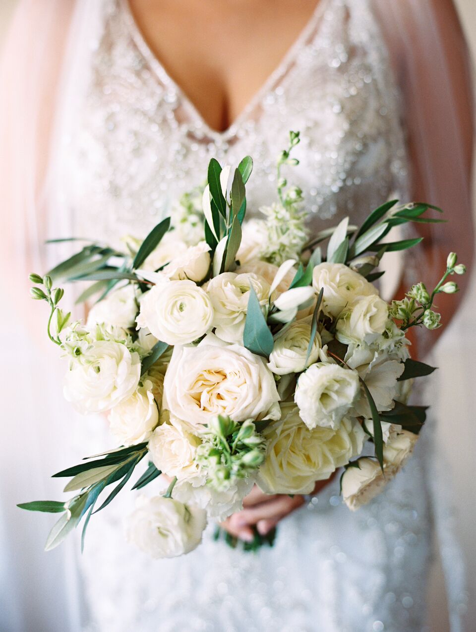 bride holding white bouquet