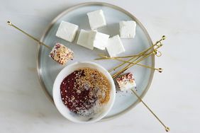 seeded feta bites served with gold skewers