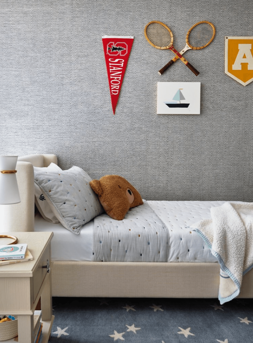 boy's room with textured wallpaper and sports decor