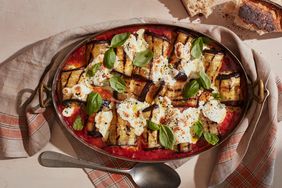 eggplant involtini with fresh tomato sauce topped with fresh basil leaves