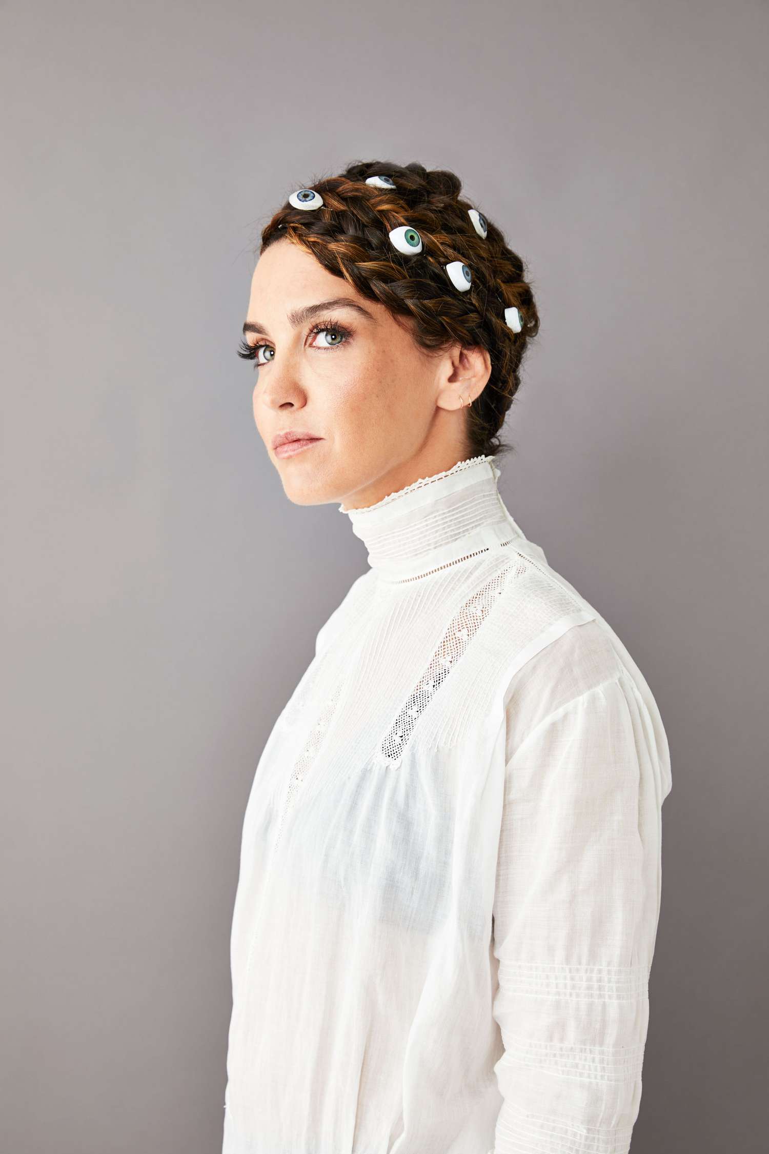 braided hair updo with doll eyes