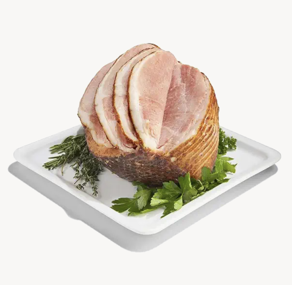 A plated ham garnished with herbs
