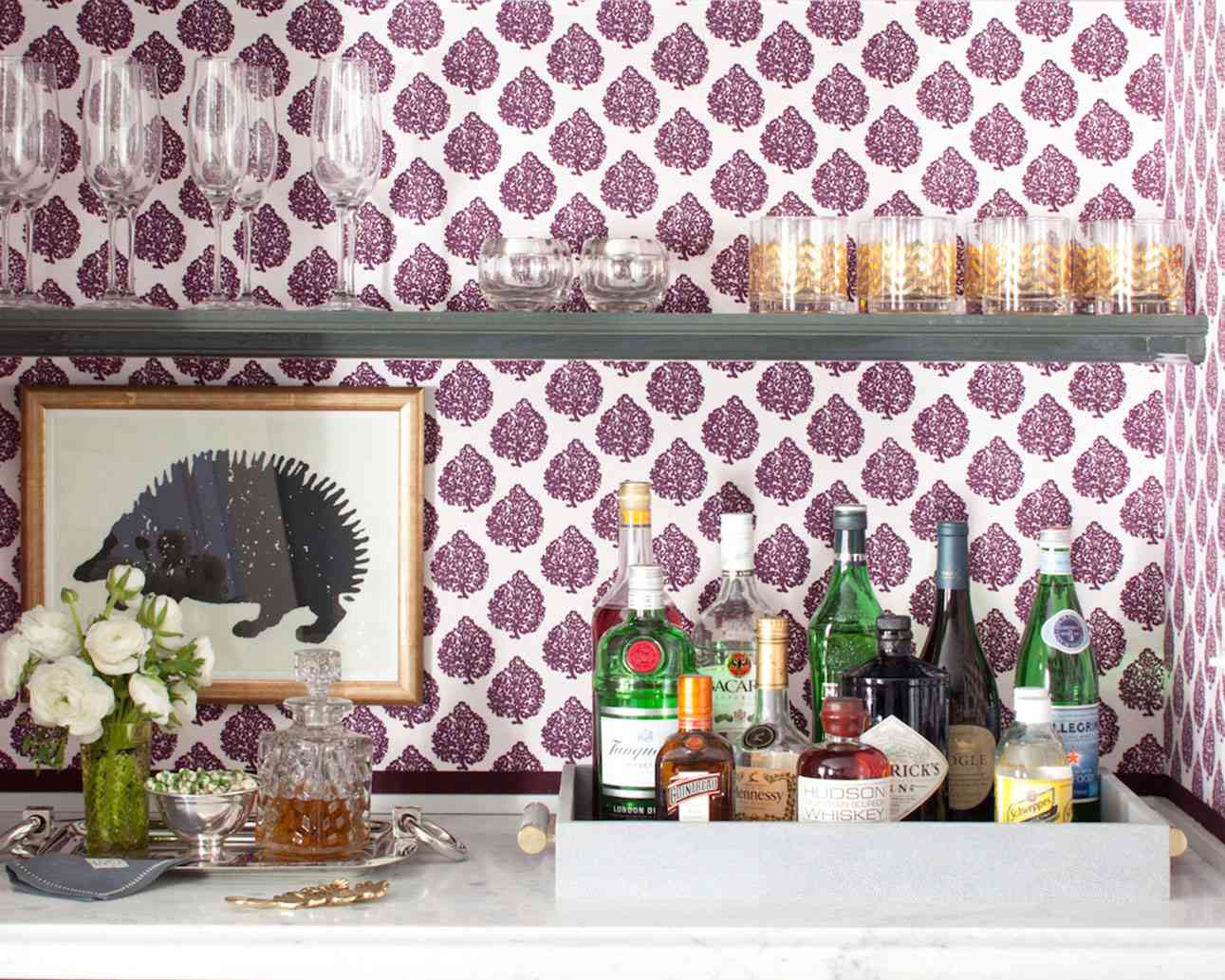 home bar with liquor bottles and glasses