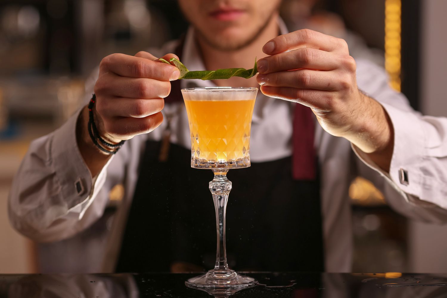 Bartender is making Pisco sour alcohol cocktail drink