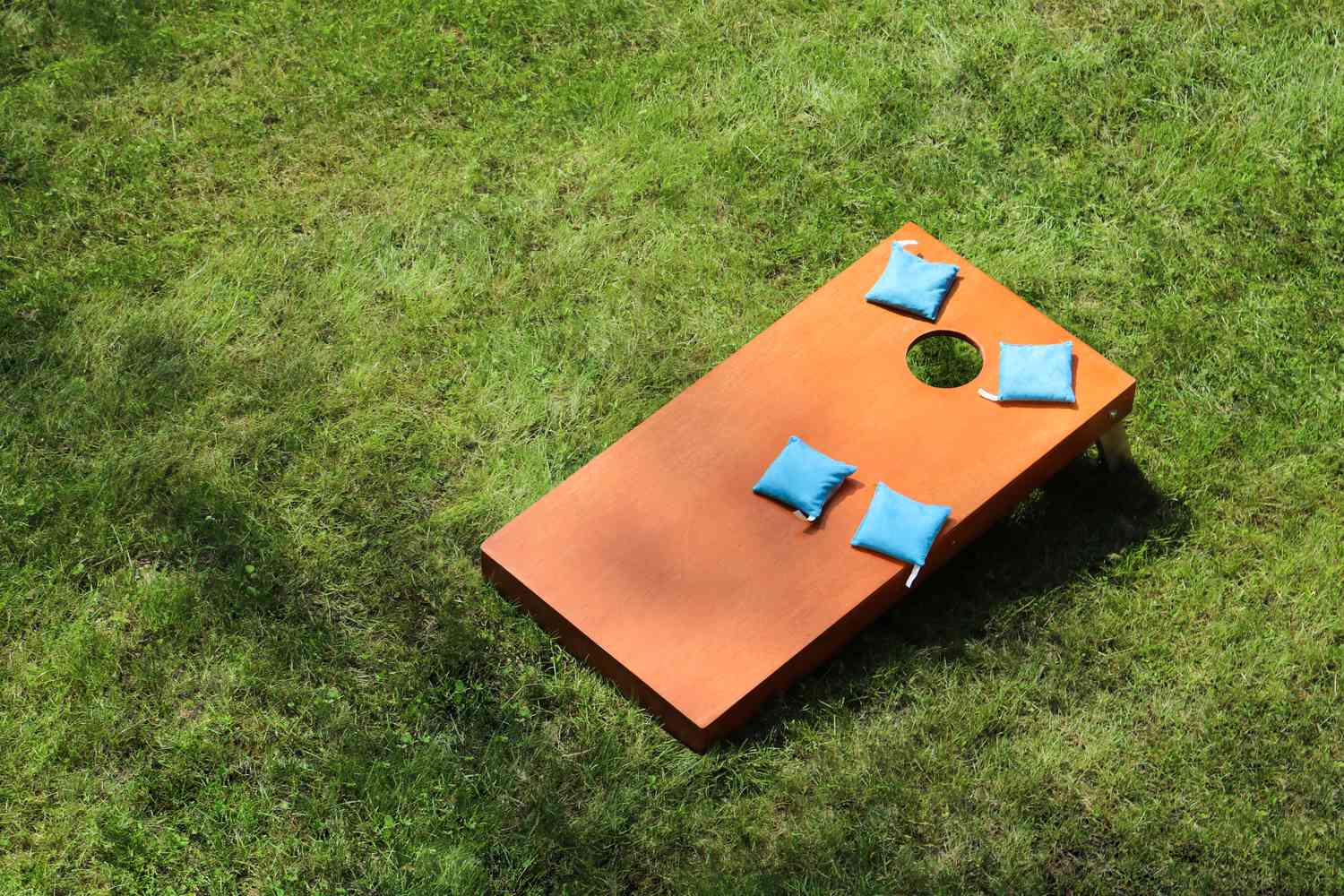 Corn-hole game in yard for summer entertainment