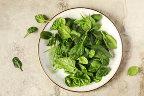 baby spinach on white plate