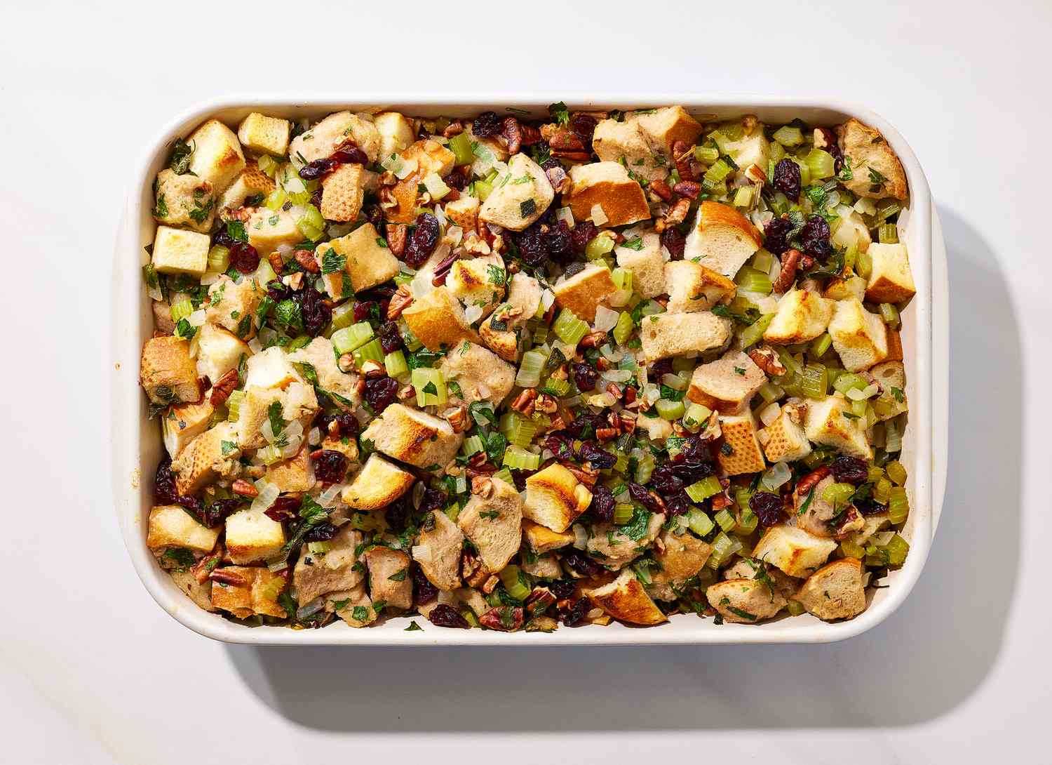 overhead view of cooked stuffing in a casserole dish