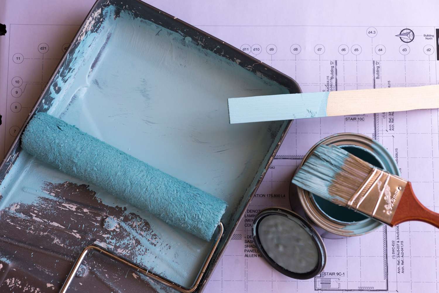 roller and blue paint for interior