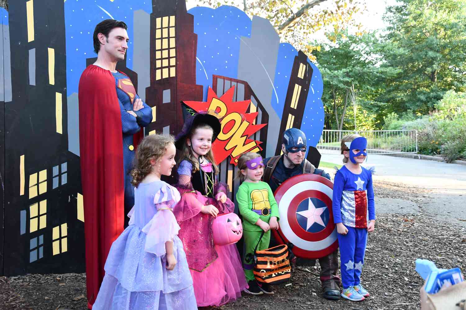 Kids taking photos with superheros