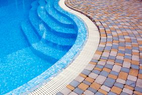 Swimming pool steps and adjacent tiled area