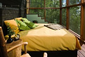 yellow bed on sleeping porch