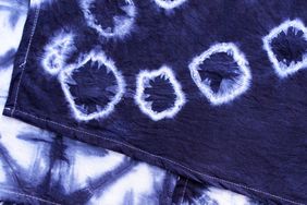 assortment of layered blue dyed fabrics