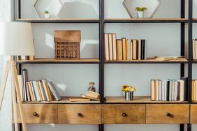 Close up of wooden rack with books in living room