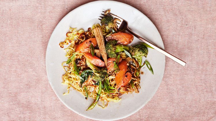vegetarian chow mein on white plate with fork