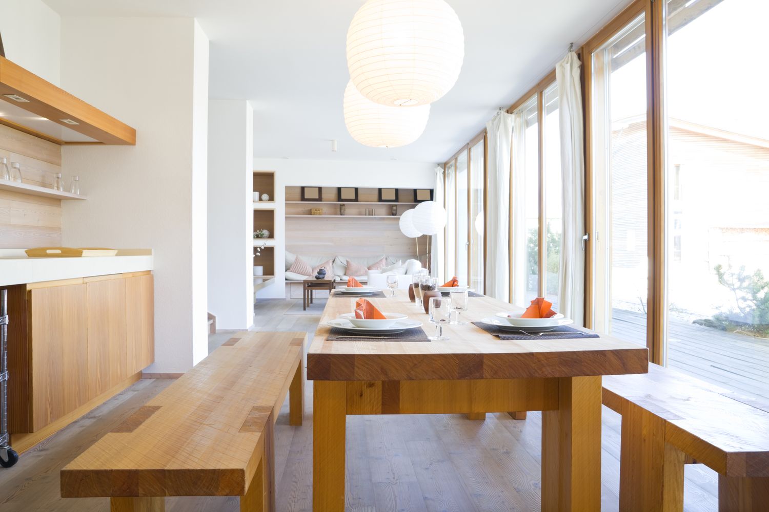 wooden dining table in a modern open kitchen
