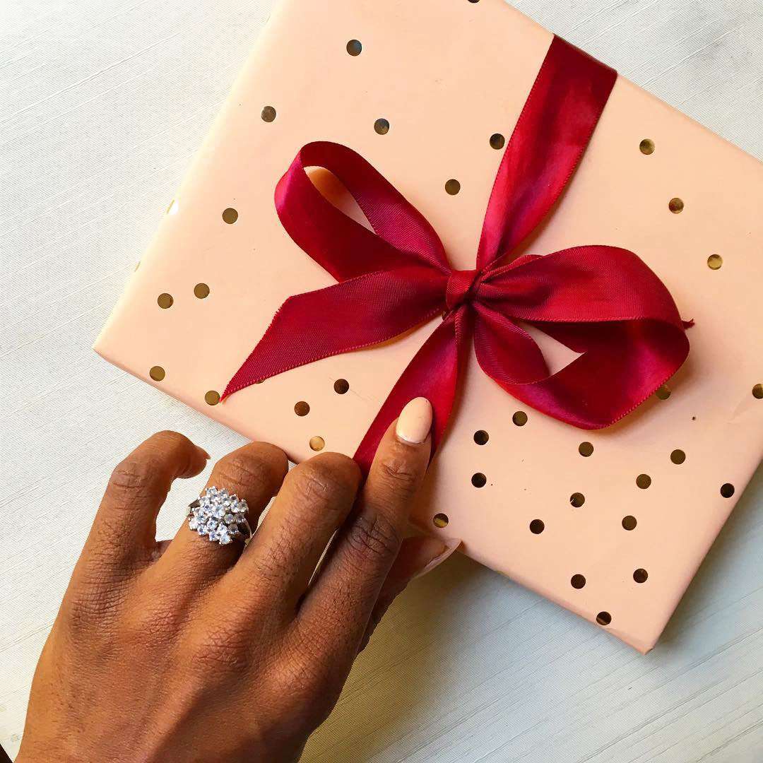 engagement ring selfie unwrapping polka dot patterned gift box