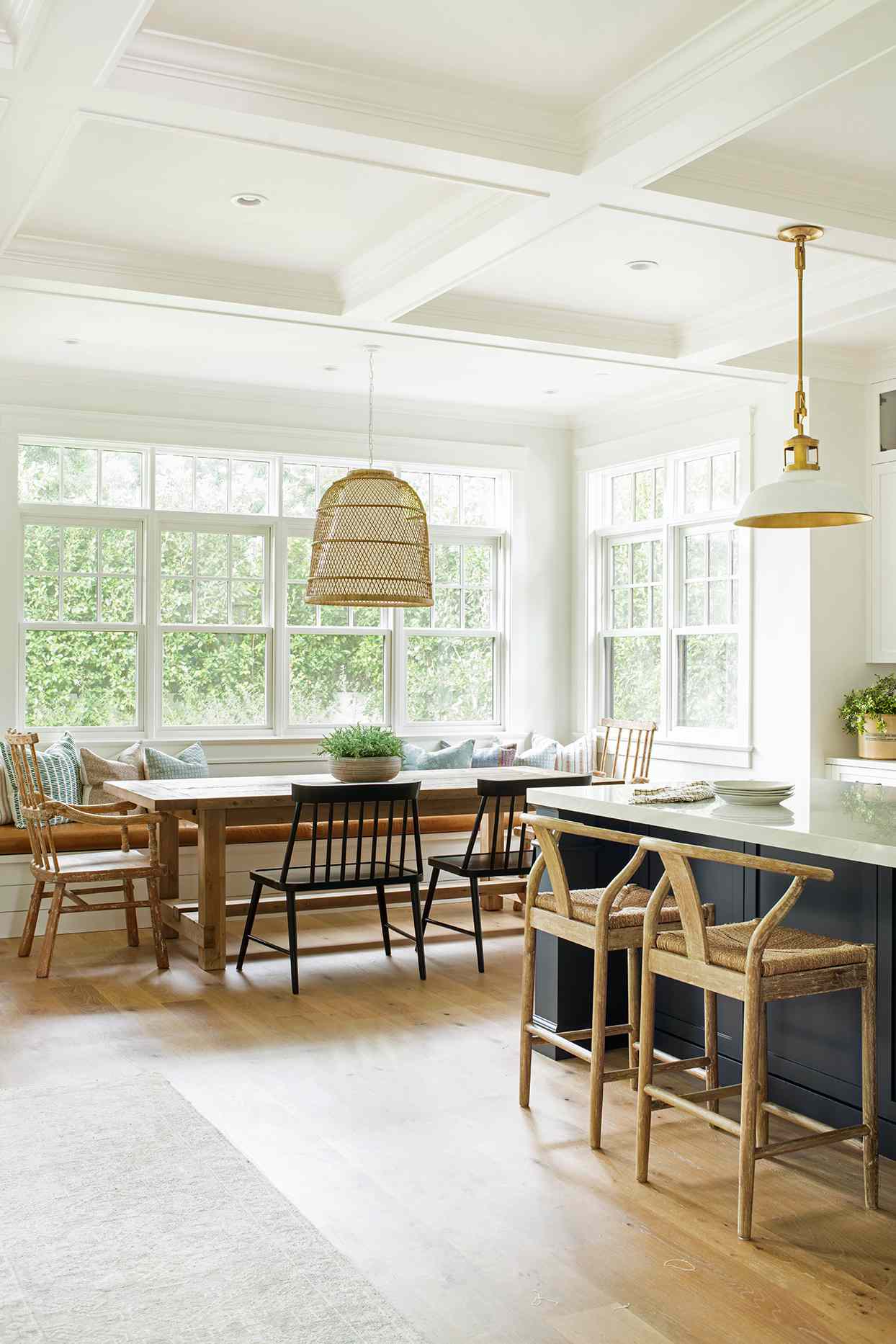 california chic naturally lit breakfast nook with wood table