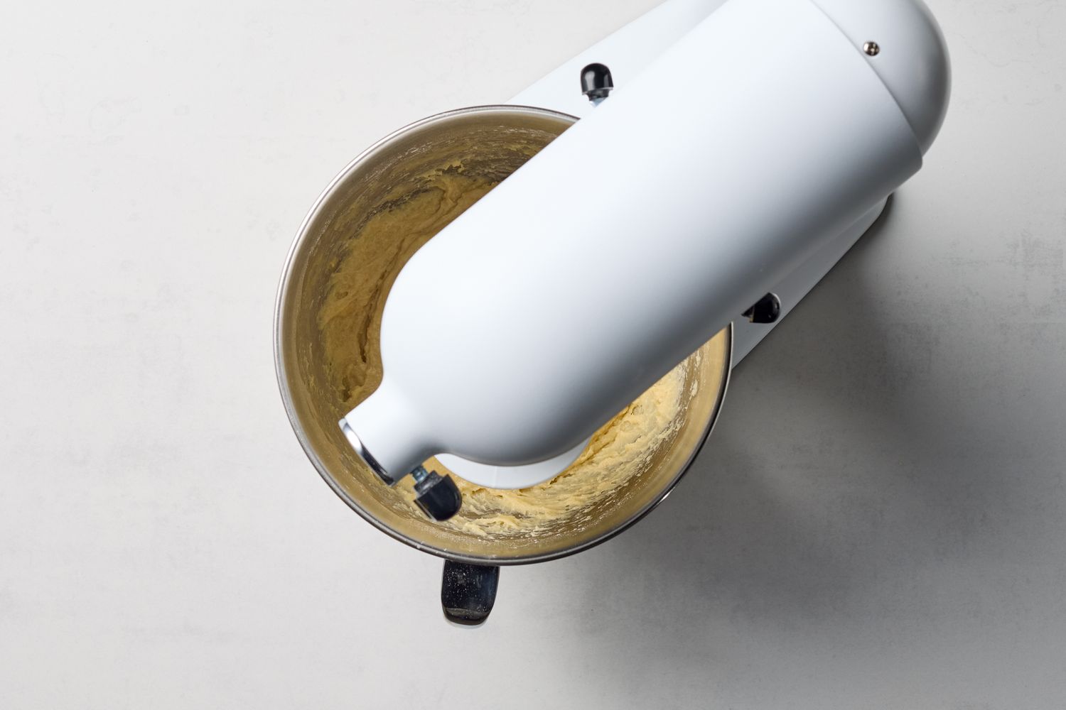Stand mixer with dough being mixed in the bowl