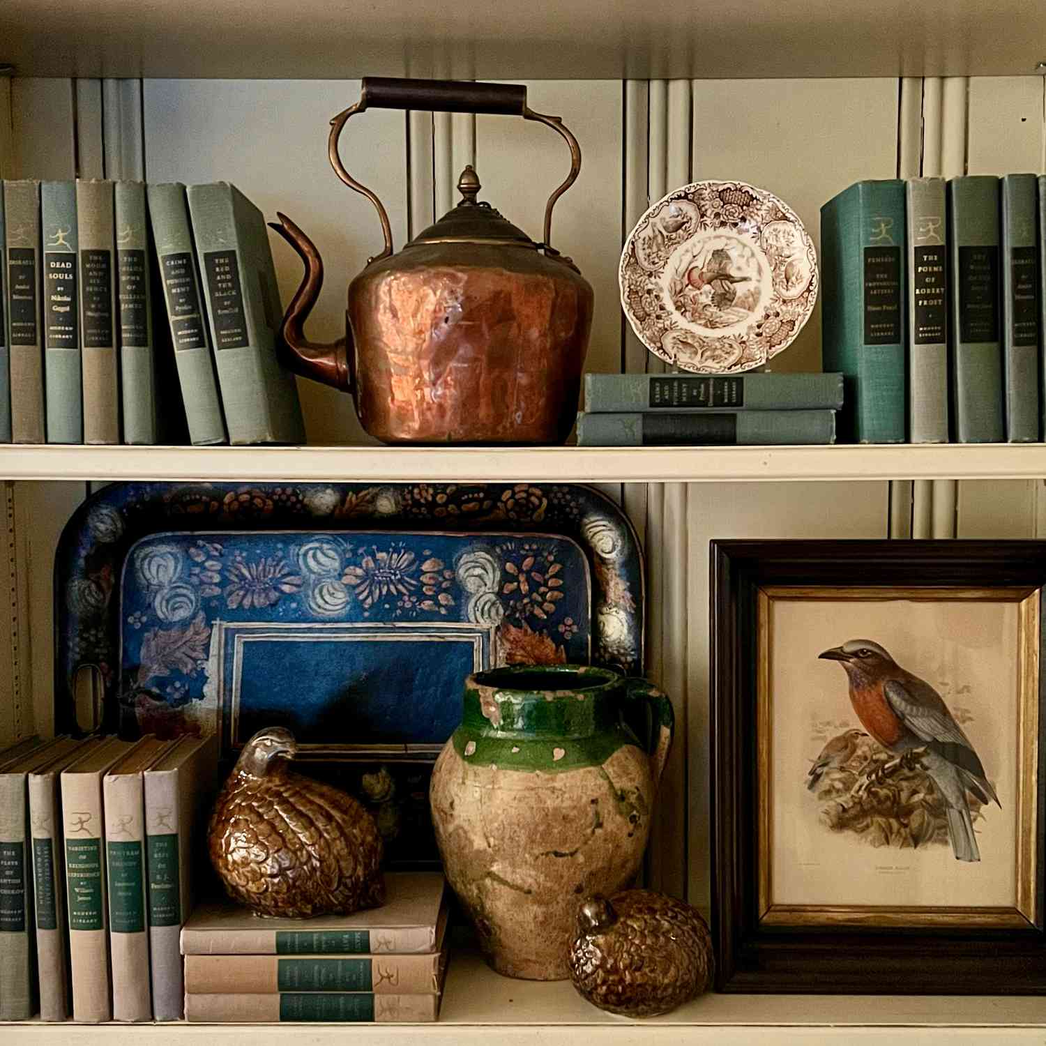 Copper pot on kitchen shelf