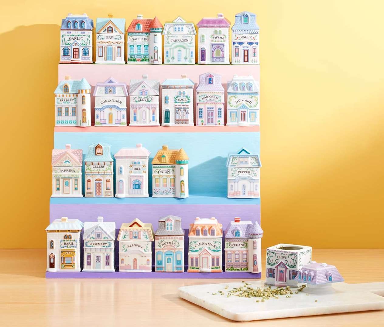 Miniature spice containers designed as buildings placed on shelves