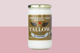 jar of beef tallow on pink background
