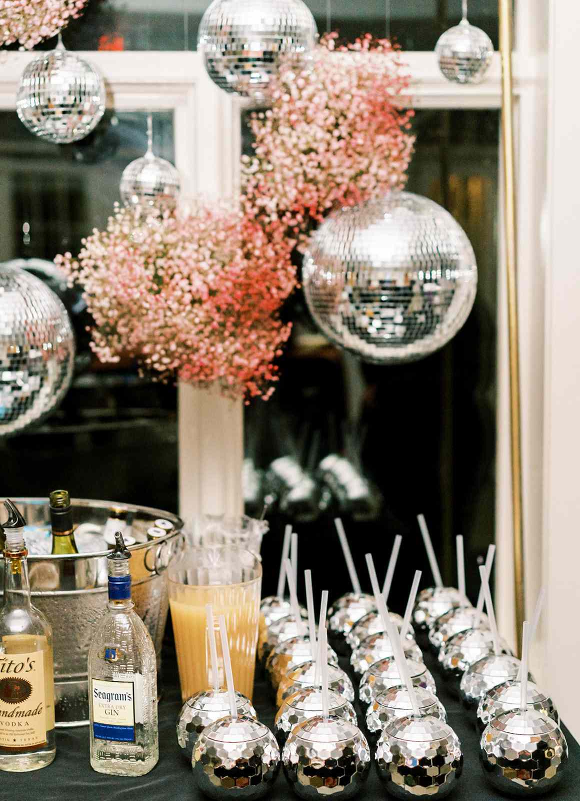 wedding after party drinks in disco ball cups with straws
