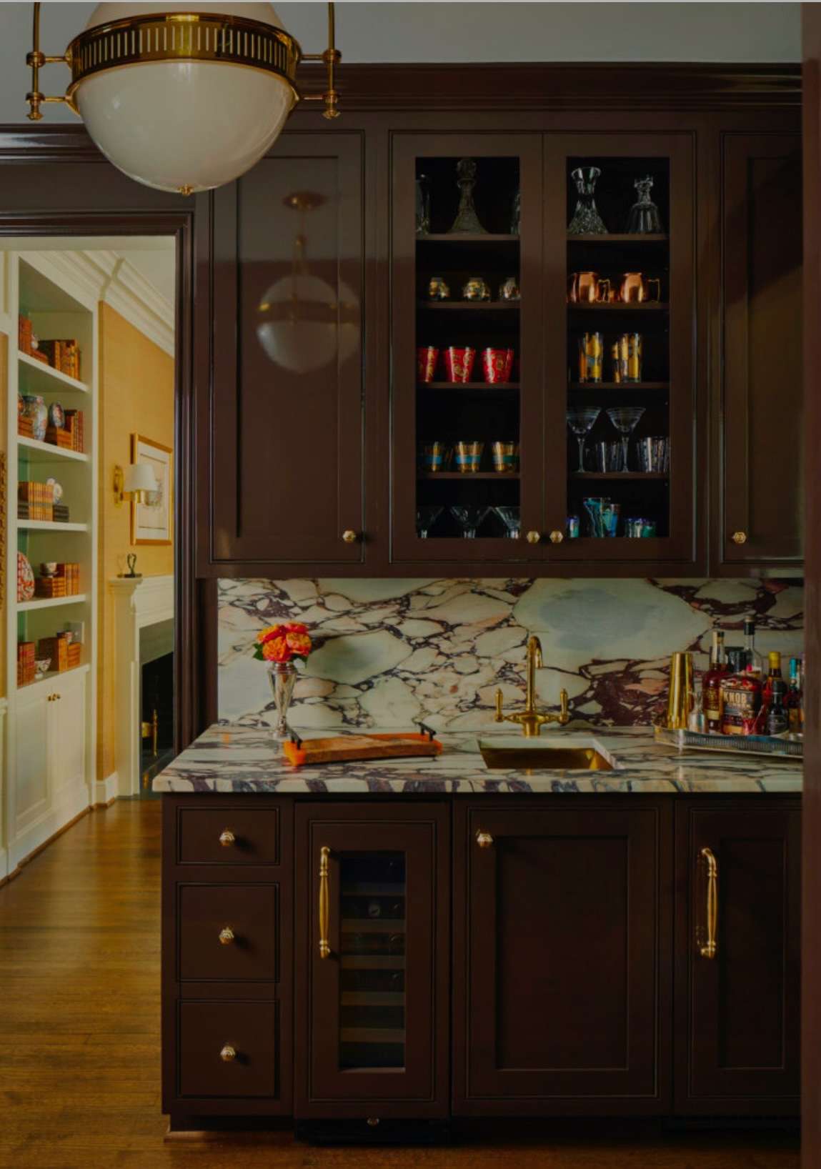 brown cabinetry with brass hardware
