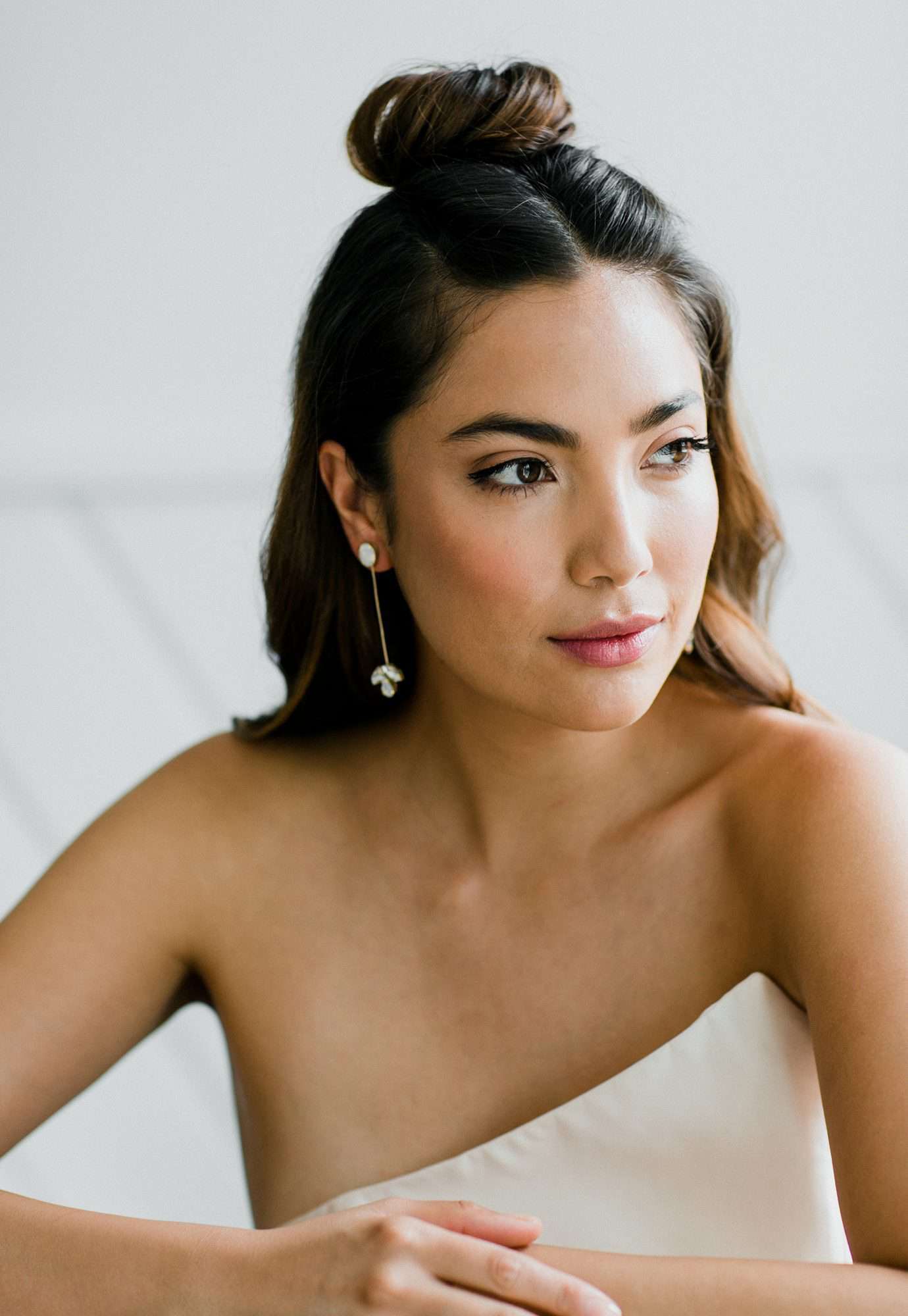 bride wearing long diamond earrings