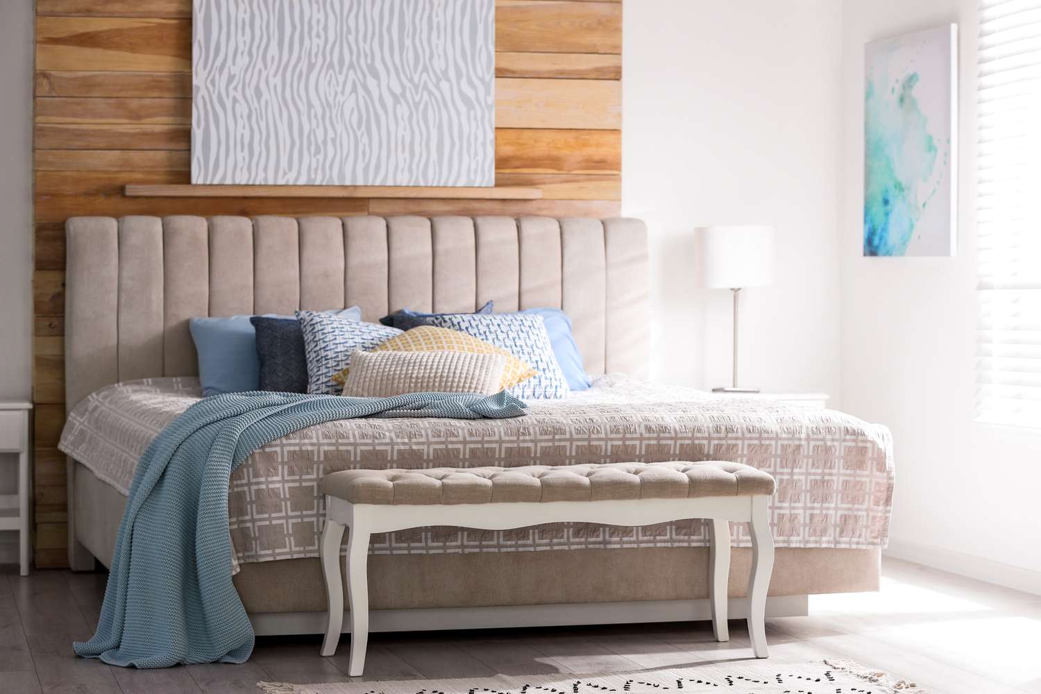 freshly-made bed in bedroom