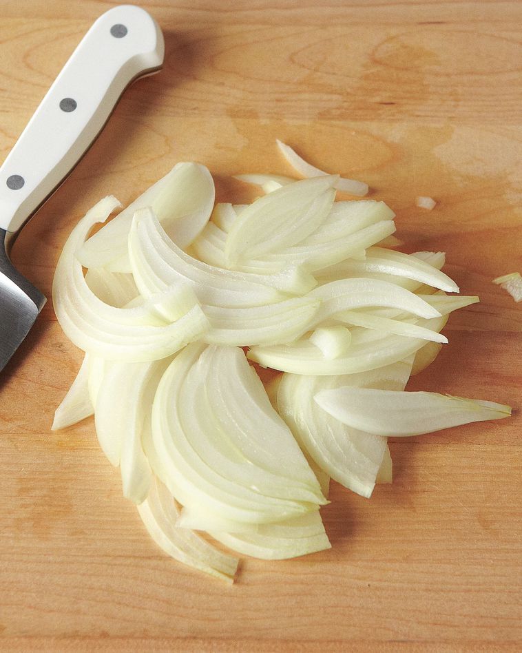 slices of onion on wooden countertop
