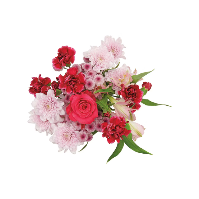A bouquet of various flowers including roses chrysanthemums and other blossoms with green leaves