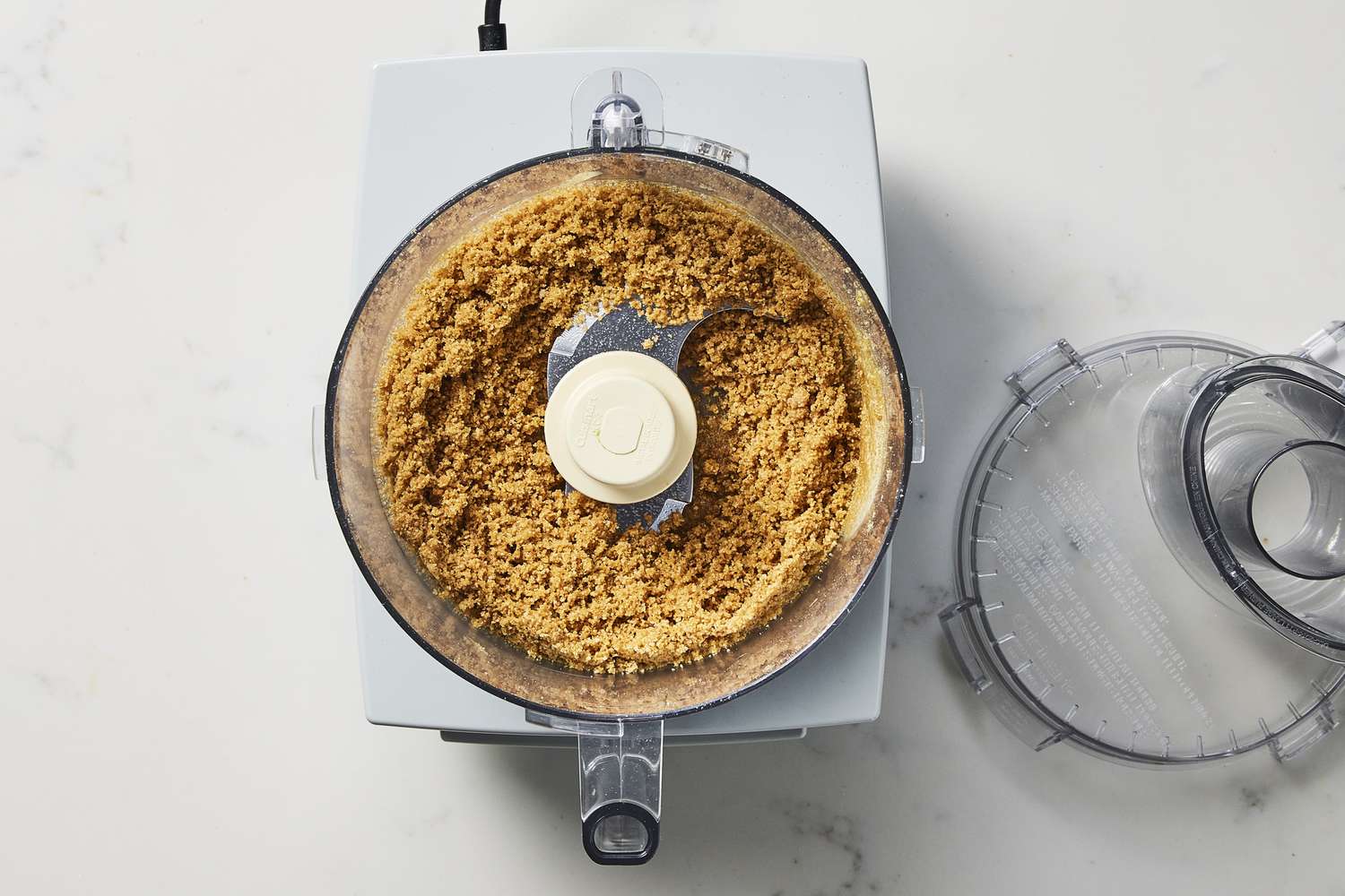 Butter and graham cracker in food processor