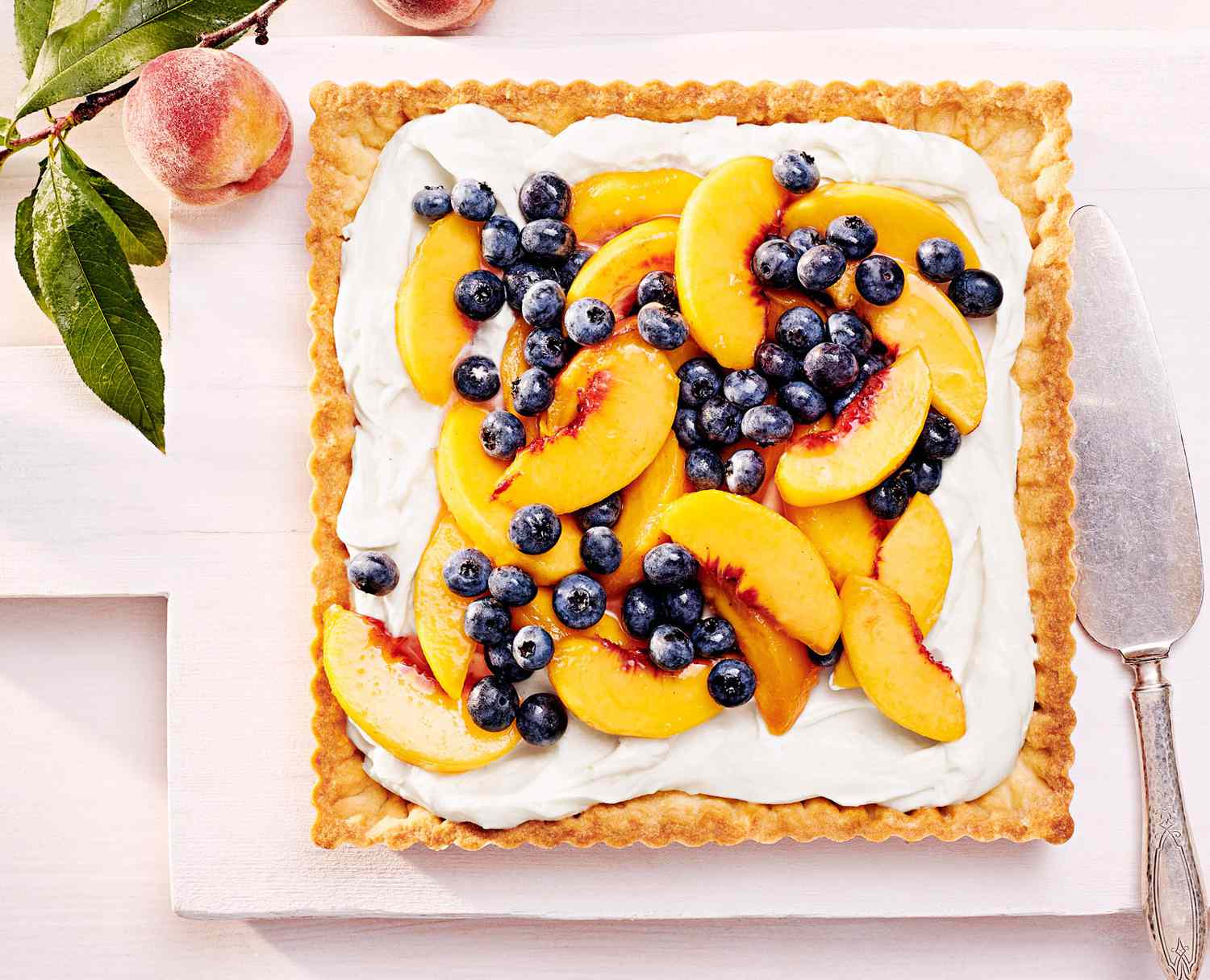 peach and blueberry tart with cream cheese filling