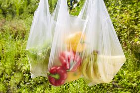 Grocery bags containing fruits and vegetables