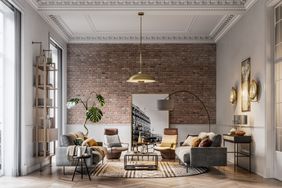 home with exposed brick wall and white molding
