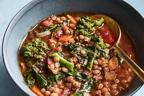 vegan lentil soup in bowl on blue table