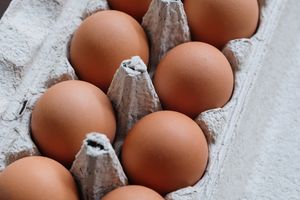 Close-up of brown eggs in carton
