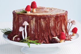 stump de noel cake on white tablecloth