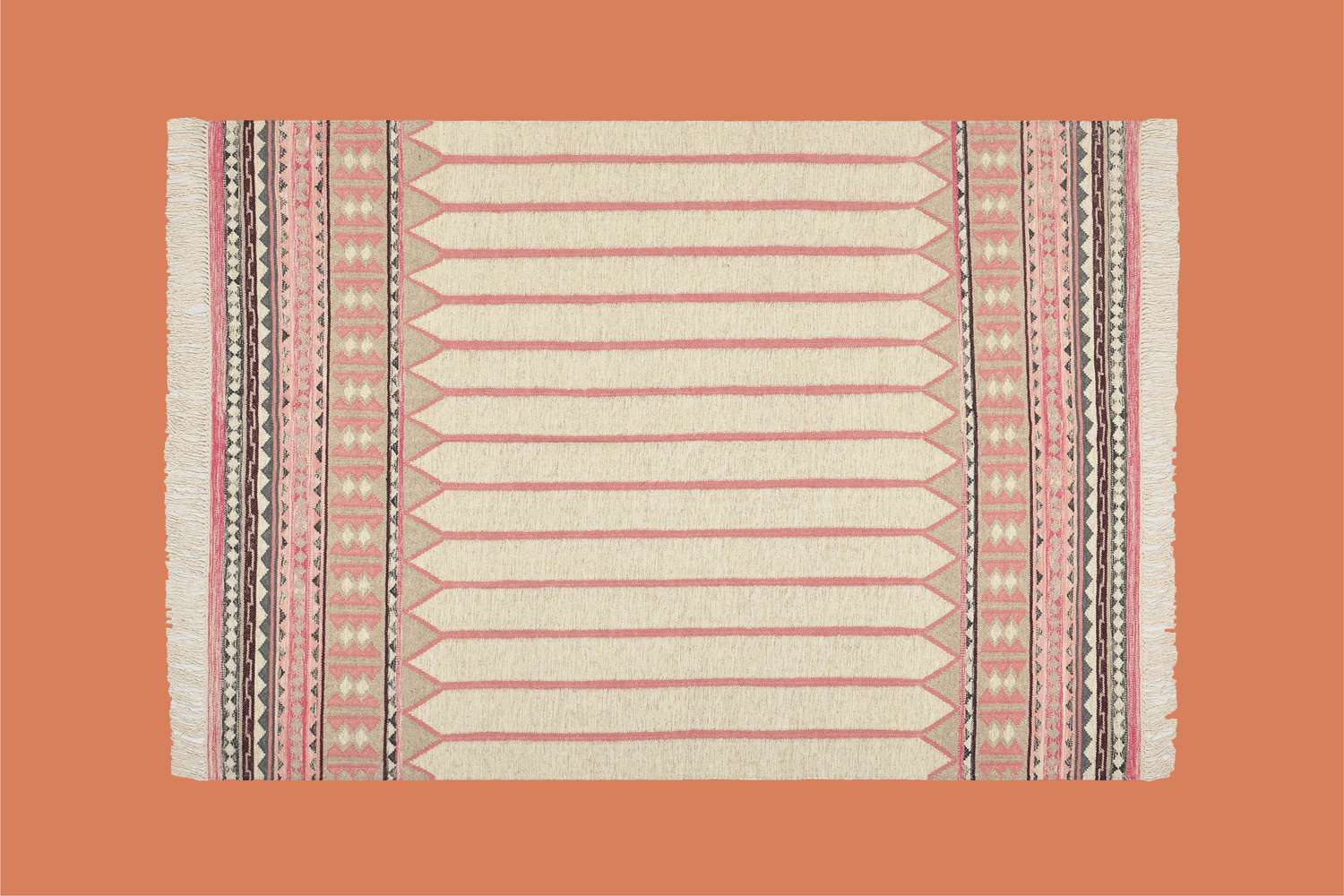 kilm tan, orange and pink rug on orange background