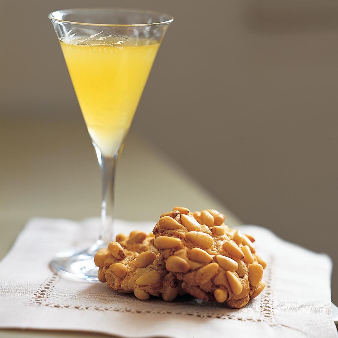 glass of limoncello and cookies
