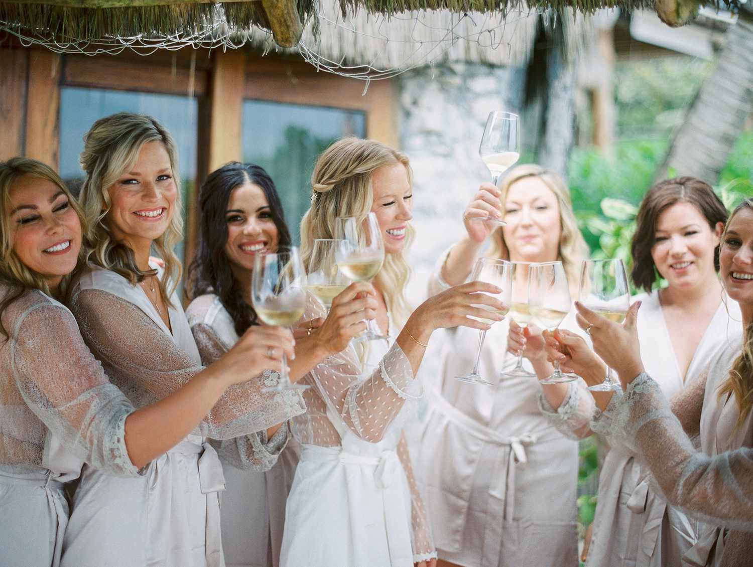 wedding bridal party getting ready and toasting white