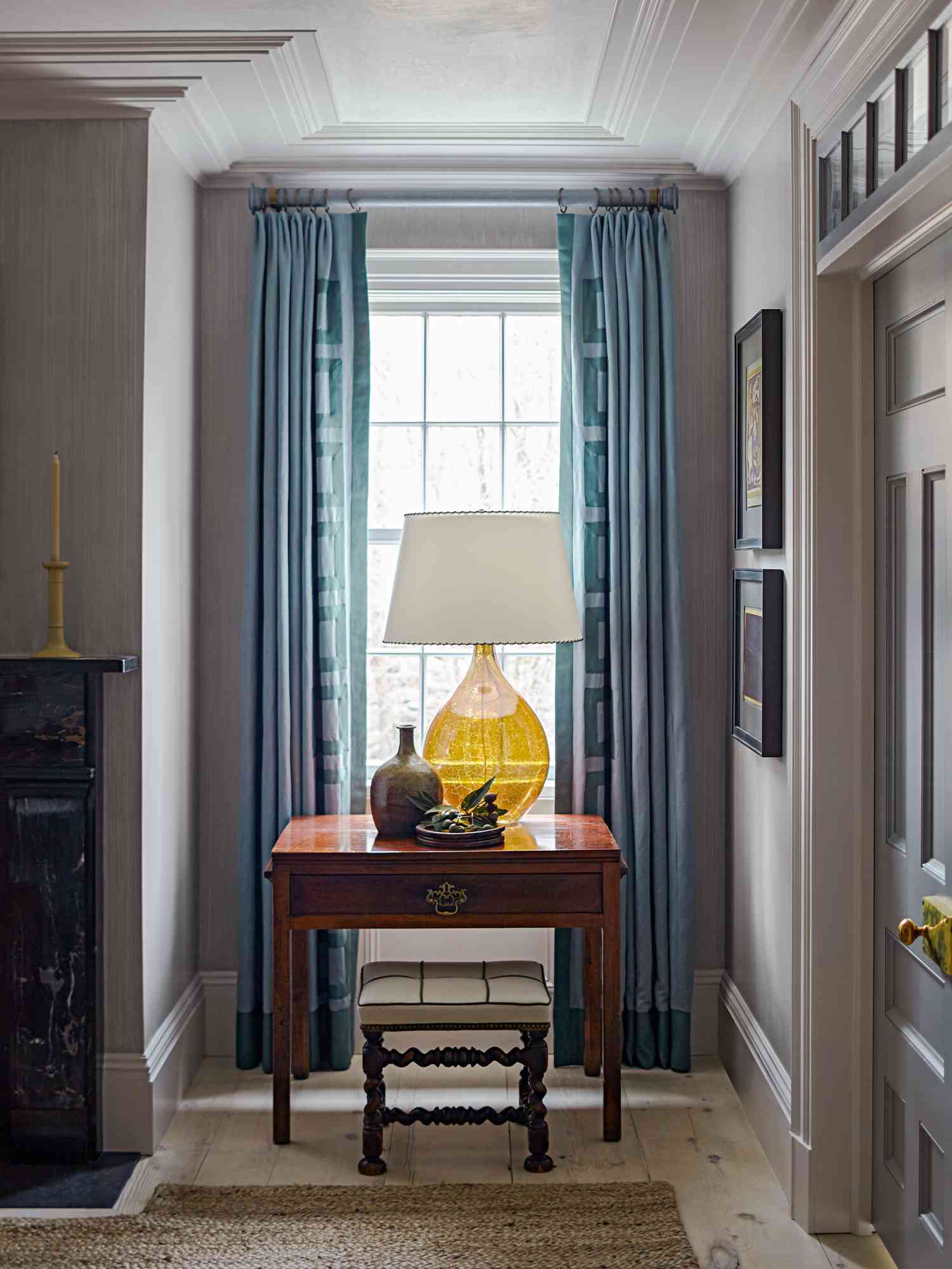 Blue drapes with a yellow lamp
