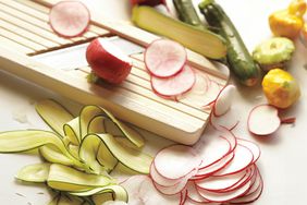 Mandolin with fruits and veggies