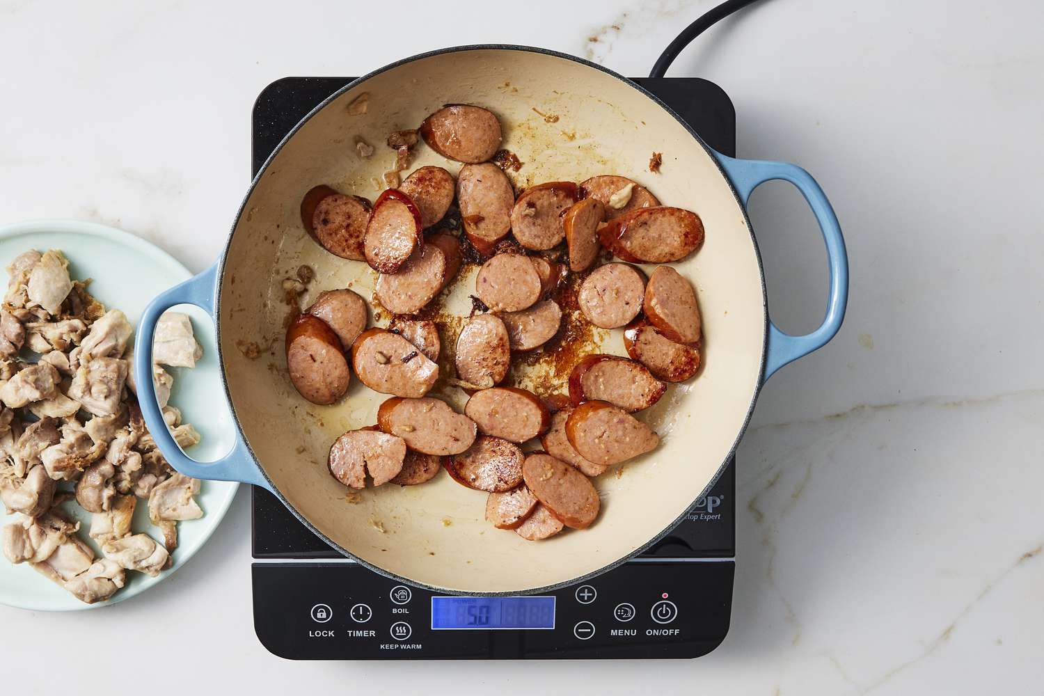 Sausage cooking in skillet