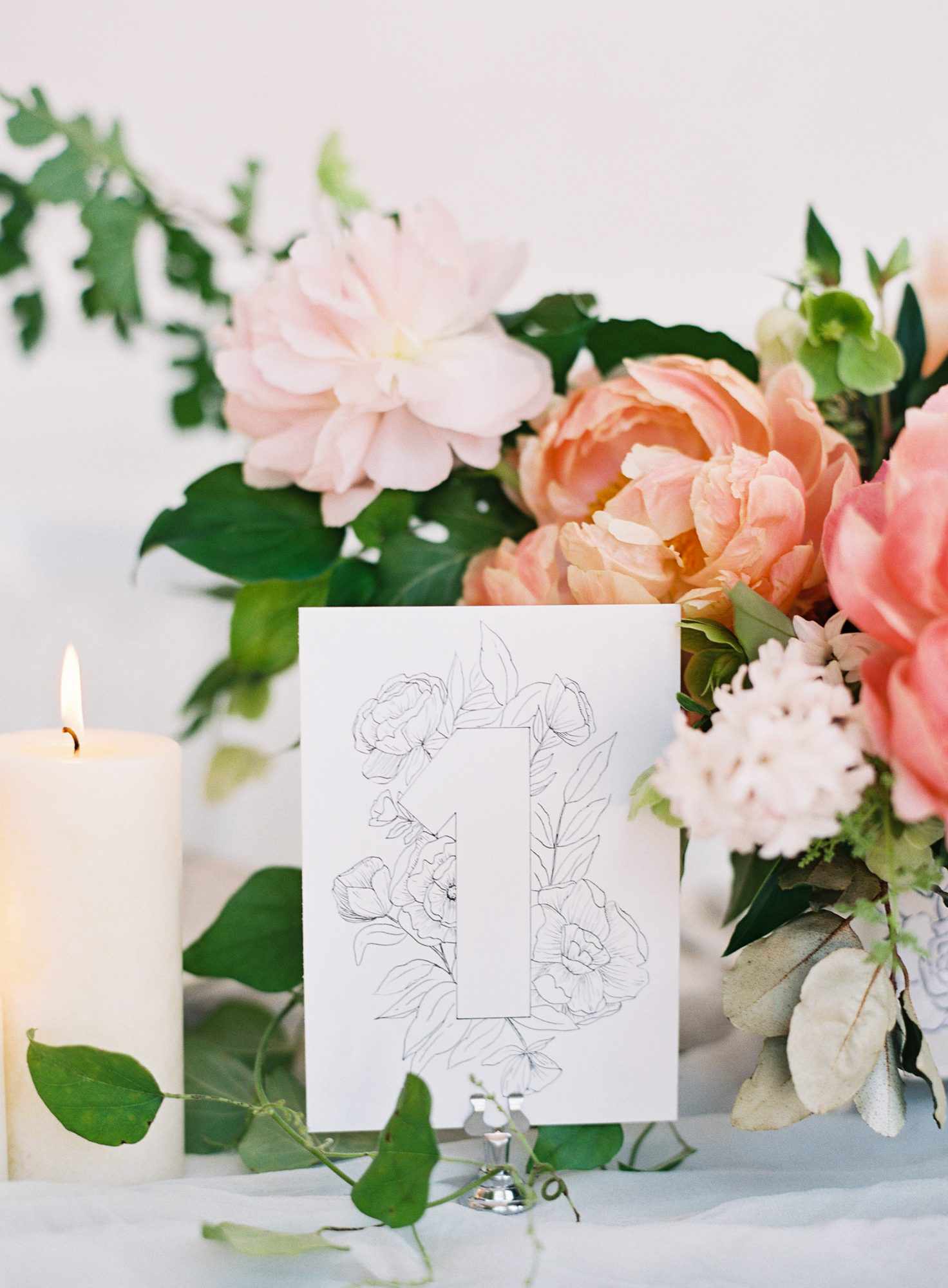 Elegant and romantic floral illustration wedding table number with peach and pink wedding centerpiece