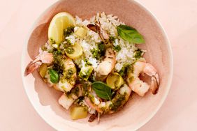 lemony shrimp and rice with pesto in pink bowl