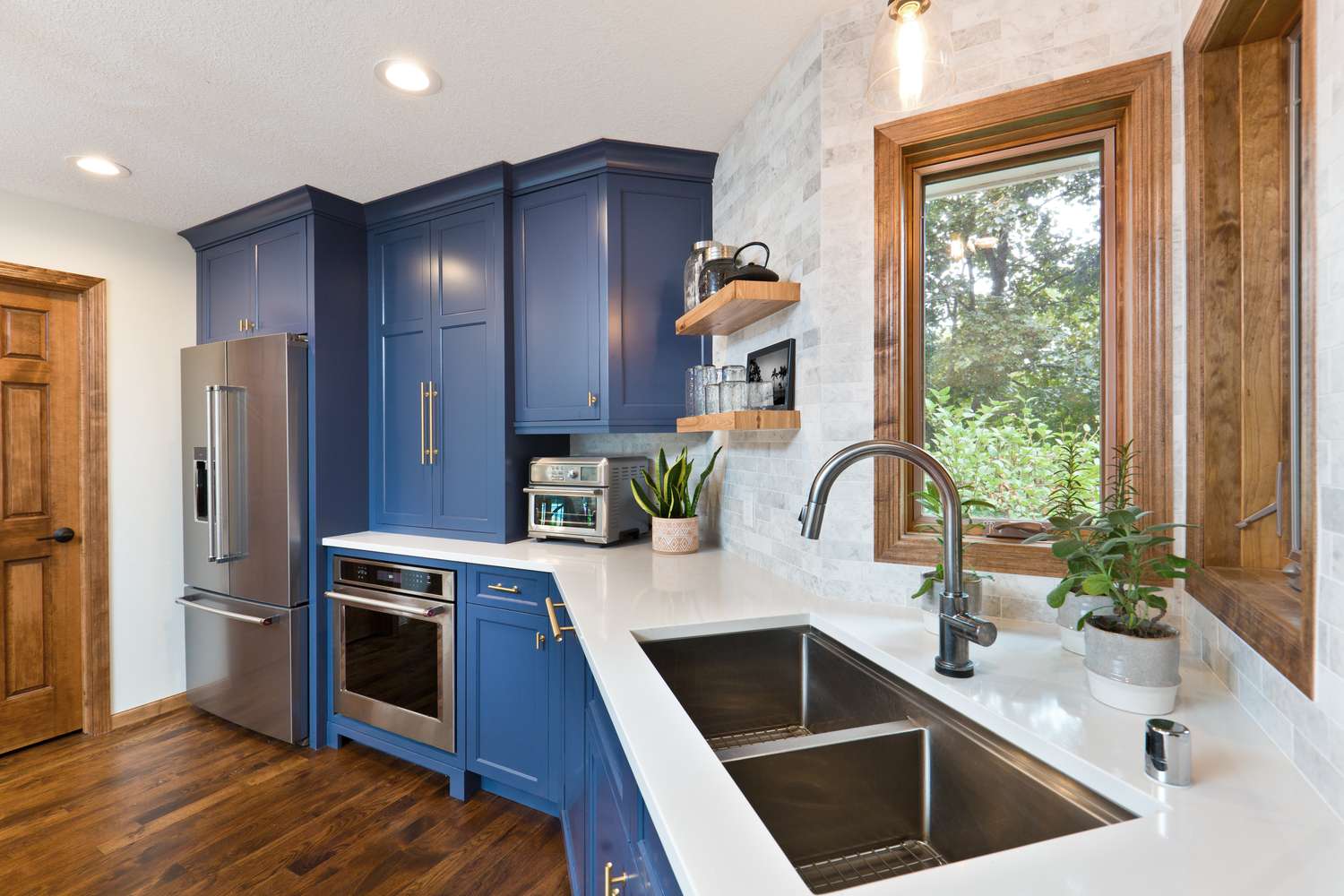 a kitchen with blue cabinets